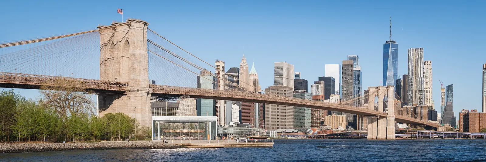 The Brooklyn Bridge with the Lower Manhattan skyline behind it, seen from the Brooklyn waterfront